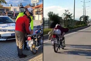 Muğla'da, motosikletini kasksız ve y&uuml;z&uuml;st&uuml; yatarak kullanan ve sosyal medyada