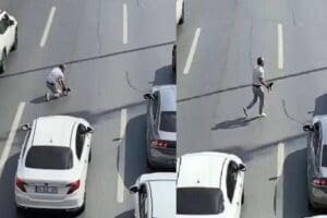Avcılar D-100 Karayolu'nda aracını durdurup trafiği kesen s&uuml;r&uuml;c&uuml;, yoldaki kediyi