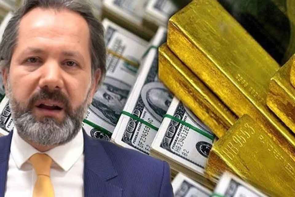 Altın ve para piyasaları uzmanı İslam Memiş, elinde T&uuml;rk lirası