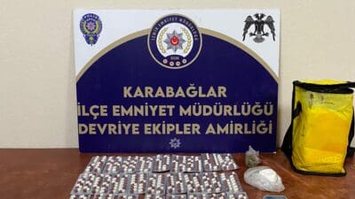 İzmir'in Karabağlar ilçesinde, bir parkta çöp kutusunda uyuşturucu sakladığı tespit