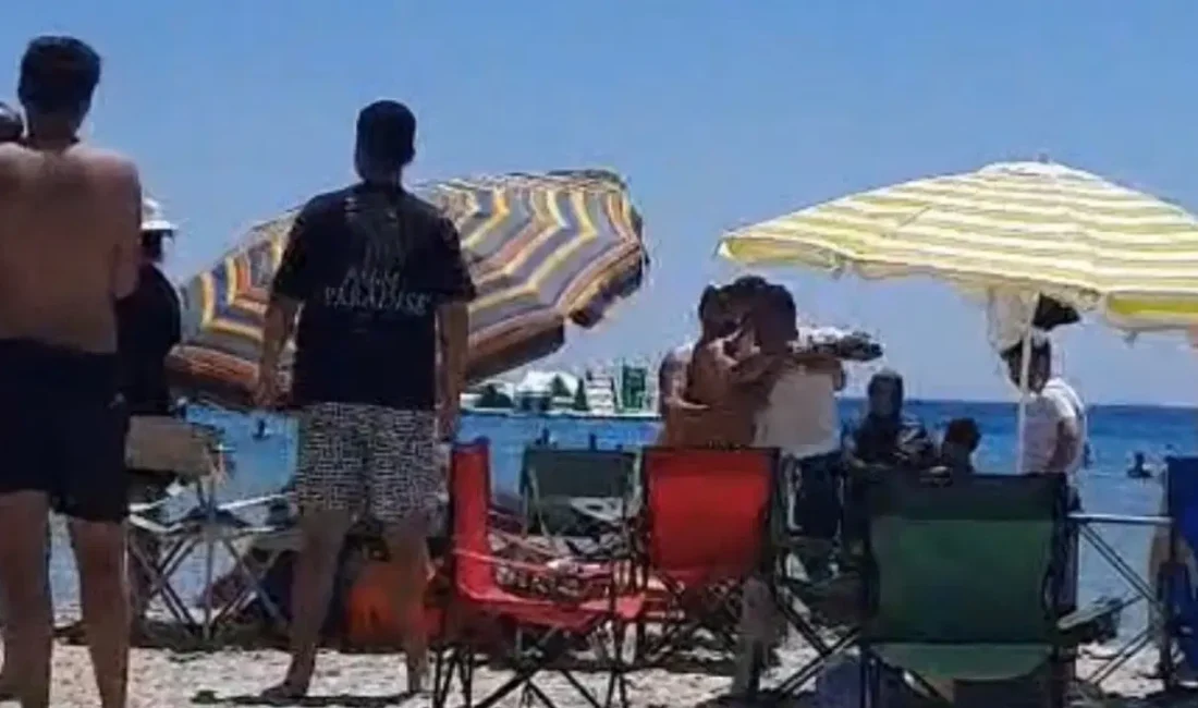 İzmir’in dünyaca ünlü Altınkum Plajı’nda, havlusunu serip şemsiyesini açmak isteyen