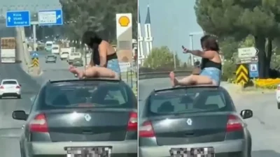 Manisa’nın Salihli ilçesinde, hareket halindeki bir otomobilin açılır tavanından çıkıp